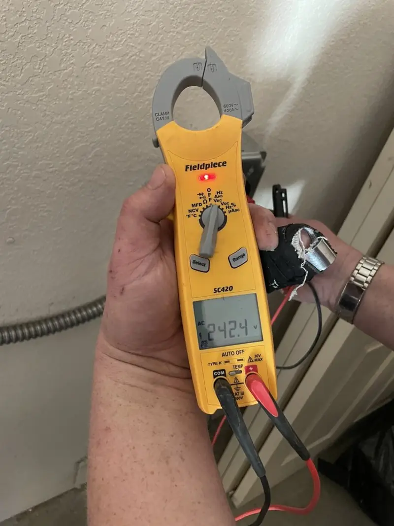 Voltage testing with clamp meter during Recessed Lighting Installation in Linton